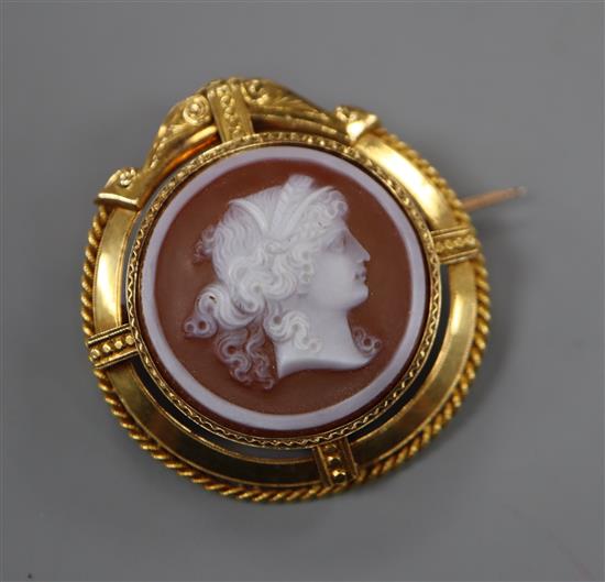 A 19th century French 18ct yellow metal mounted sardonyx cameo pendant brooch, carved with the bust of a lady to sinister, 35mm.